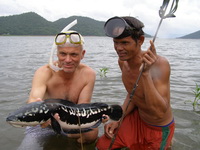 Jeremy dives with Dar to catch a giant snakehead 
